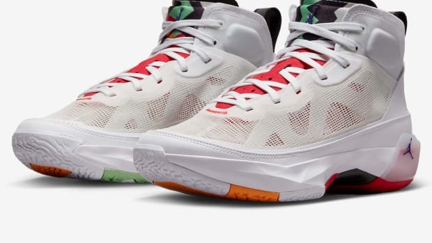 View of white and red Air Jordan shoes.